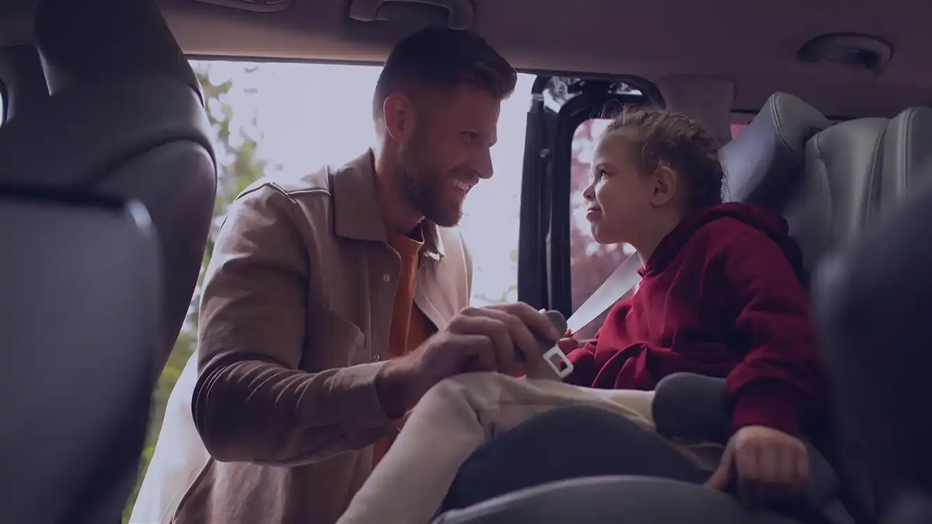 Father and daughter shopping from car